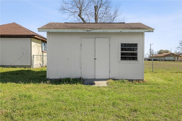 view of shed with fence