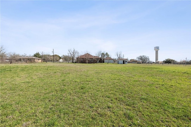 view of yard with a rural view