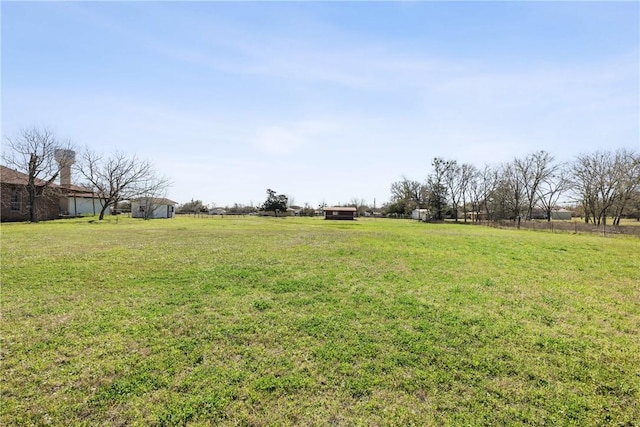 view of yard with a rural view