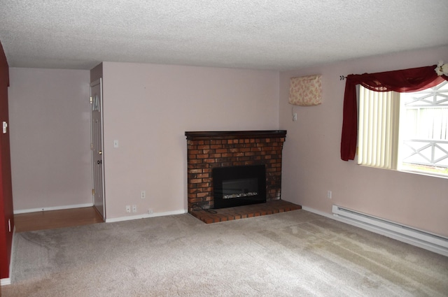 unfurnished living room with baseboard heating, a textured ceiling, a brick fireplace, and carpet floors