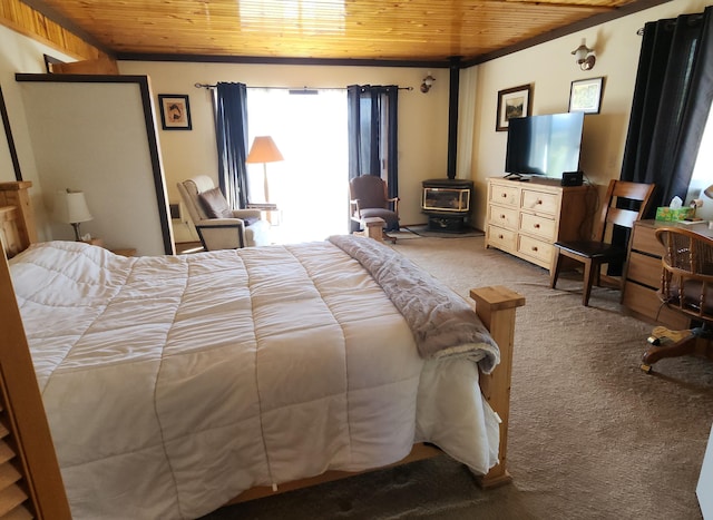 bedroom featuring a wood stove, wood ceiling, and light colored carpet