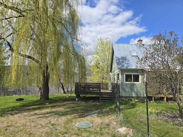 view of yard featuring a wooden deck
