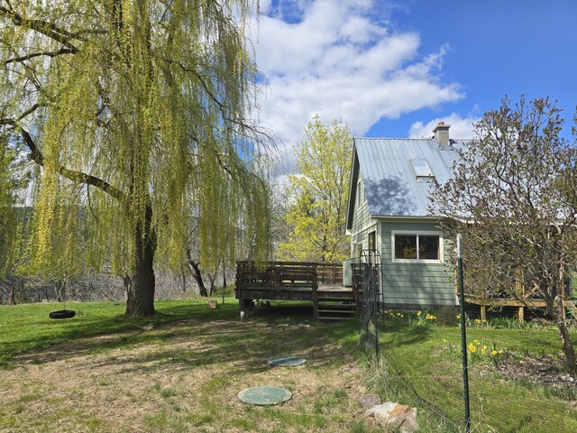 3434 Rockcut Rd, Kettle Falls, WA 99141 - view of grassy yard with a deck