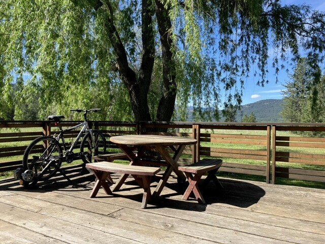 3434 Rockcut Rd, Kettle Falls, WA 99141 - deck featuring outdoor dining area and a mountain view