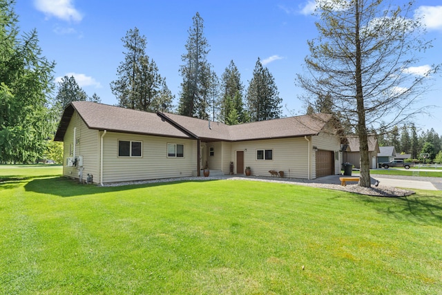 325 Hogans Way, Chewelah, WA 99109 - view of front of home with an attached garage, a front yard, and driveway