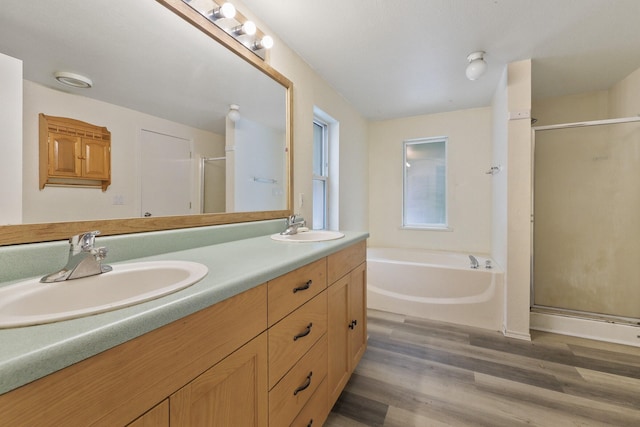 4087 Hesseltine Rd, Valley, WA 99181 - bathroom with a sink, a garden tub, a shower stall, and wood finished floors