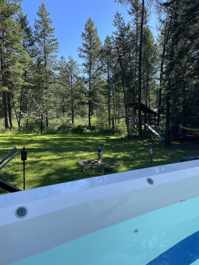 4087 Hesseltine Rd, Valley, WA 99181 - view of swimming pool with a lawn