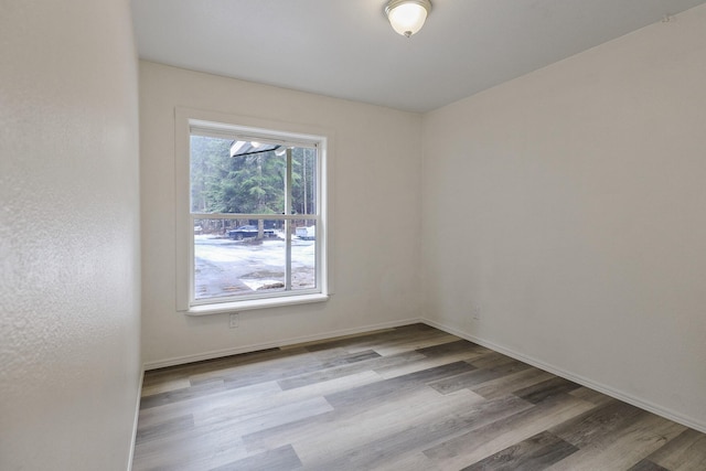 4087 Hesseltine Rd, Valley, WA 99181 - unfurnished room featuring baseboards and wood finished floors