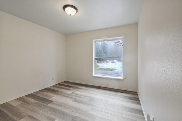 4087 Hesseltine Rd, Valley, WA 99181 - unfurnished room with baseboards and light wood-type flooring