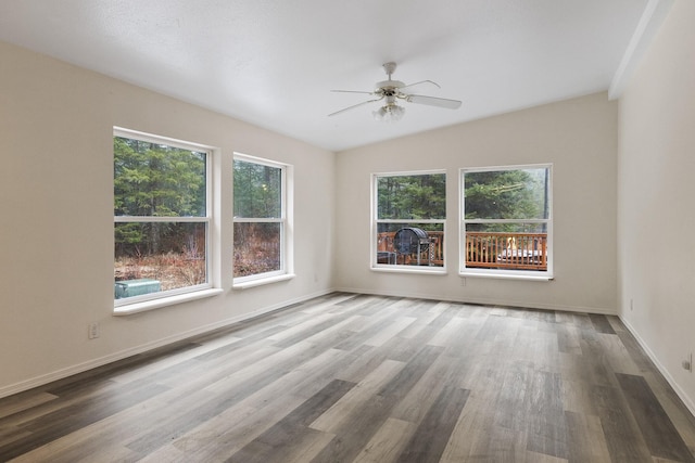 4087 Hesseltine Rd, Valley, WA 99181 - unfurnished room with baseboards, ceiling fan, and wood finished floors