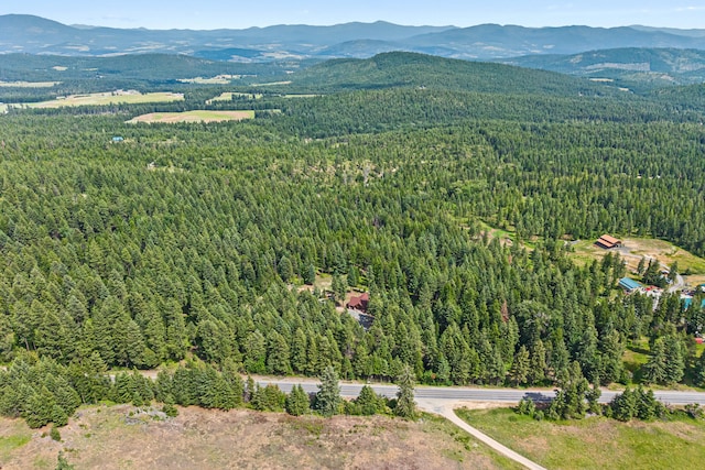 1157 Orin-Rice Rd, Colville, WA 99114 - aerial overview of property's location with a forest and mountains