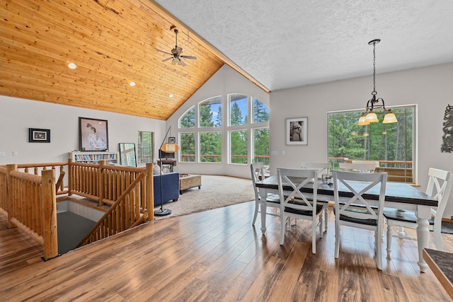 1157 Orin-Rice Rd, Colville, WA 99114 - dining room featuring wood finished floors, ceiling fan, high vaulted ceiling, and a chandelier