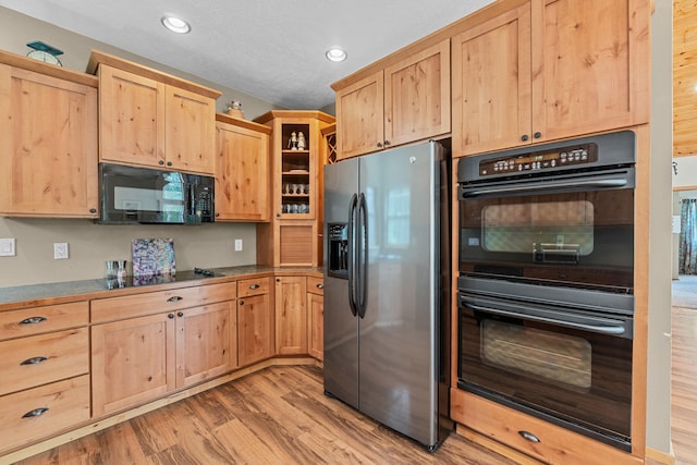 1157 Orin-Rice Rd, Colville, WA 99114 - kitchen featuring black appliances, light brown cabinetry, light wood-style floors, and recessed lighting