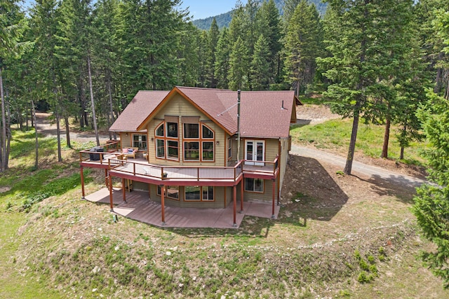 1157 Orin-Rice Rd, Colville, WA 99114 - rear view of property featuring a wooden deck, a view of trees, and a patio area