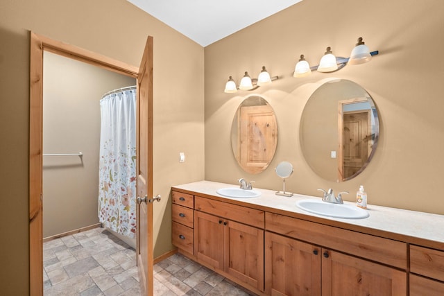 1157 Orin-Rice Rd, Colville, WA 99114 - bathroom featuring double vanity, stone finish floors, and a shower with curtain