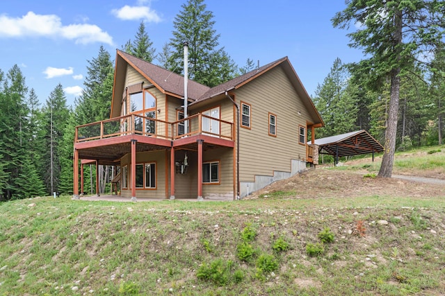 1157 Orin-Rice Rd, Colville, WA 99114 - back of house with a wooden deck and a detached carport