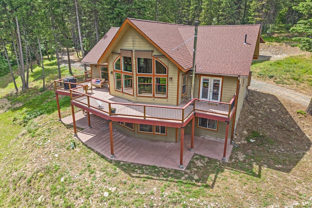 1157 Orin-Rice Rd, Colville, WA 99114 - back of house featuring a deck, a patio, a wooded view, and french doors