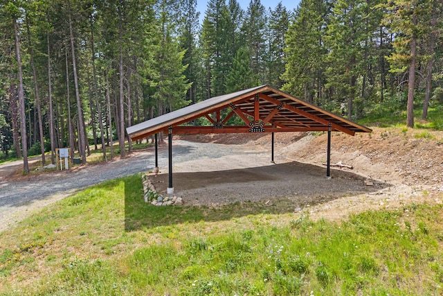 1157 Orin-Rice Rd, Colville, WA 99114 - view of property's community with a detached carport, driveway, and a forest view