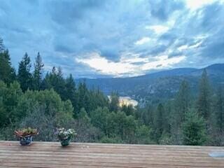 3164 Denney Ranch Way, Kettle Falls, WA 99141 - view of mountain backdrop with a heavily wooded area