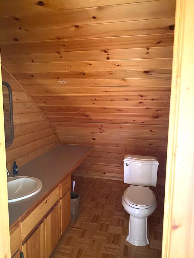3164 Denney Ranch Way, Kettle Falls, WA 99141 - half bathroom with toilet, vanity, wooden walls, and wooden ceiling