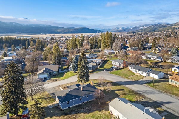 birds eye view of property with a mountain view