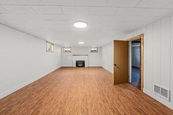 basement featuring wood-type flooring