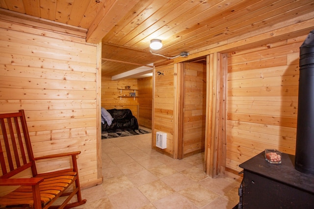 corridor featuring wood walls and wooden ceiling