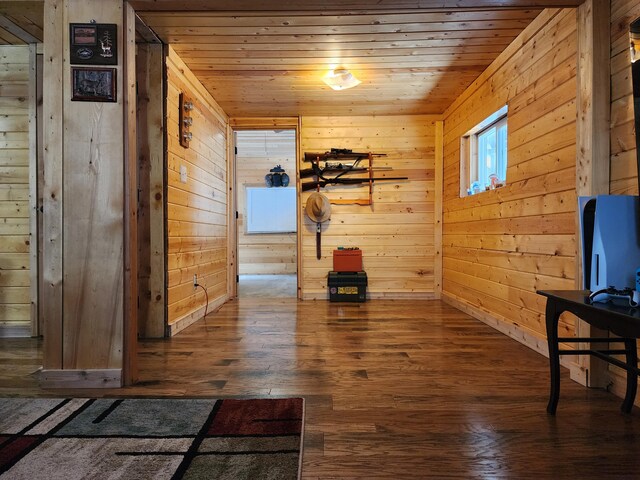 interior space featuring wooden ceiling, wooden walls, and dark hardwood / wood-style floors