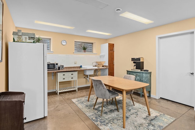 dining space with concrete floors