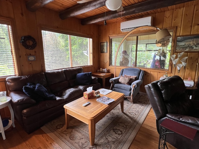 3901 Cedar Creek Rd, Colville, WA 99114 - living area featuring wood ceiling, beamed ceiling, a wall unit AC, wood walls, and wood finished floors