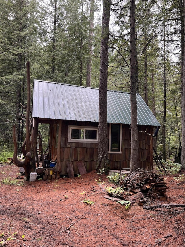 3901 Cedar Creek Rd, Colville, WA 99114 - view of side of property with metal roof and a forest view