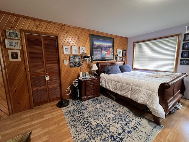 3901 Cedar Creek Rd, Colville, WA 99114 - bedroom with light wood finished floors, a closet, and wooden walls