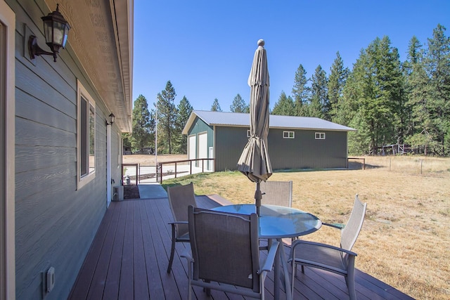 wooden deck with a yard