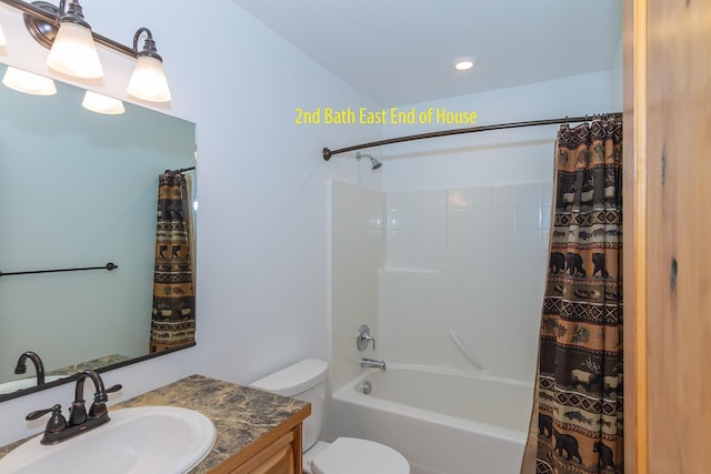 full bathroom featuring vanity, toilet, and shower / bath combo with shower curtain