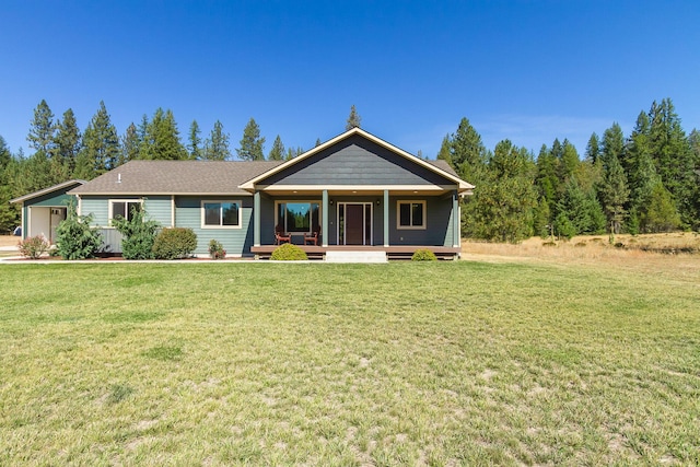 view of front of house with a porch and a front yard