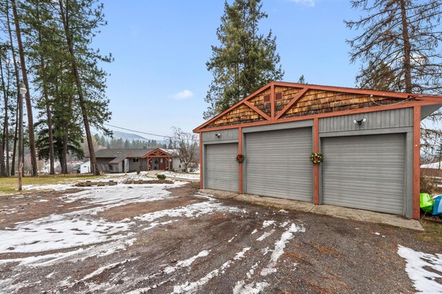 view of snow covered garage