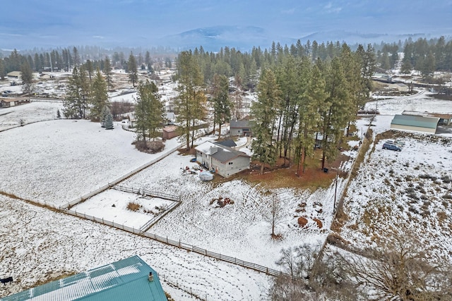 snowy aerial view with a mountain view