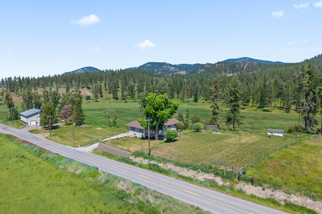 2829 Cottonwood Creek Rd, Chewelah, WA 99109 - back of property with a deck with mountain view and roof with shingles