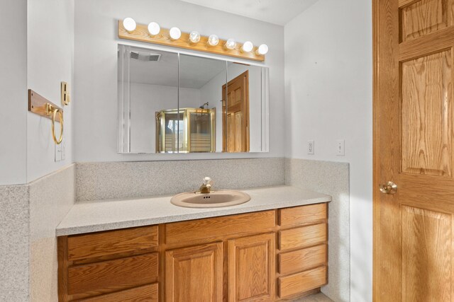 2829 Cottonwood Creek Rd, Chewelah, WA 99109 - bathroom with vanity and a shower with shower door