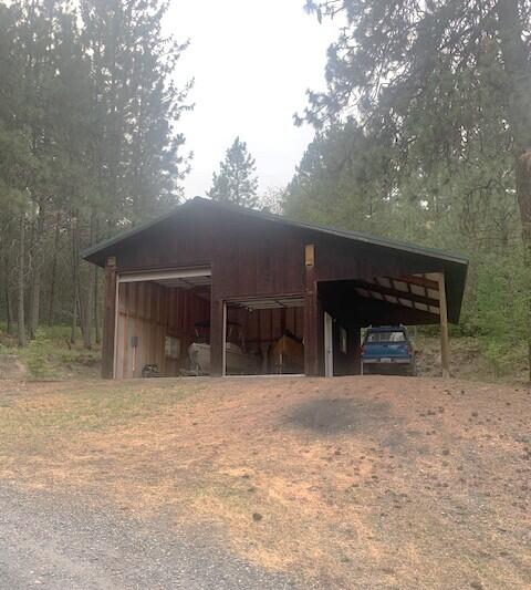 59 Bisbee Creek Ln, Kettle Falls, WA 99141 - view of pole building with driveway