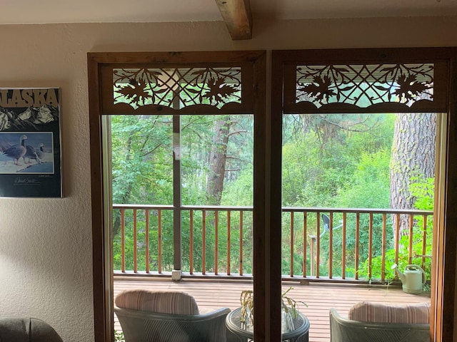 59 Bisbee Creek Ln, Kettle Falls, WA 99141 - doorway featuring a textured wall and beam ceiling