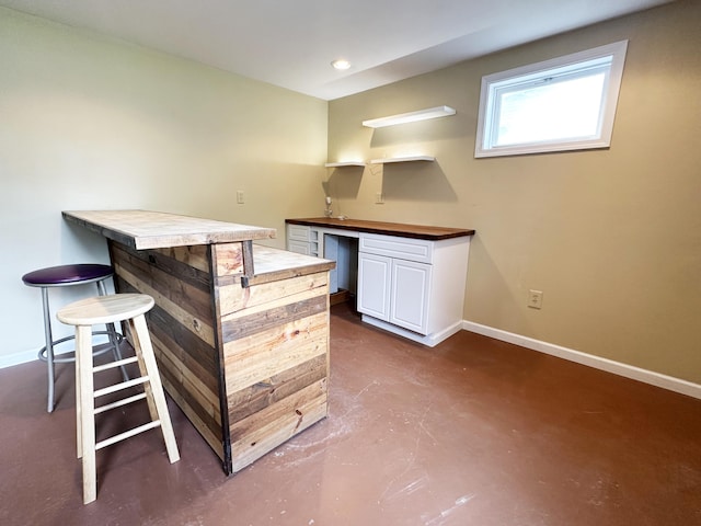824 S Chester St, Colville, WA 99114 - bar area featuring finished concrete floors, baseboards, and recessed lighting