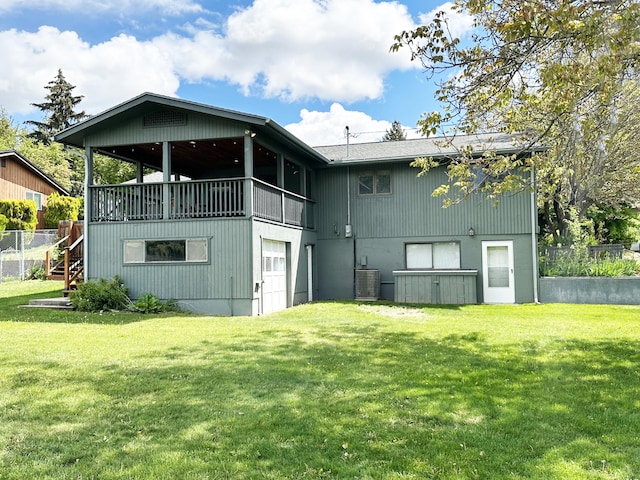 824 S Chester St, Colville, WA 99114 - rear view of house featuring central AC unit, stairs, and an attached garage