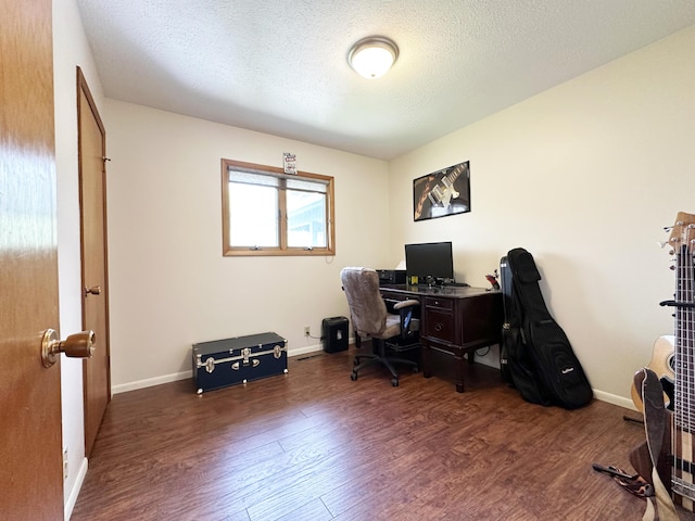 824 S Chester St, Colville, WA 99114 - home office featuring wood finished floors, baseboards, and a textured ceiling