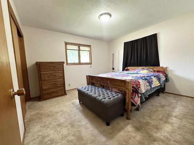 824 S Chester St, Colville, WA 99114 - carpeted bedroom featuring a textured ceiling and baseboards