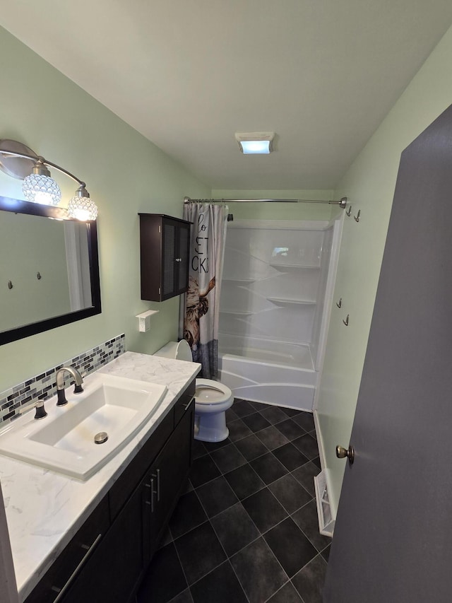 641 S Alder St, Colville, WA 99114 - full bathroom with vanity, tile patterned floors, shower / bath combo, toilet, and tasteful backsplash