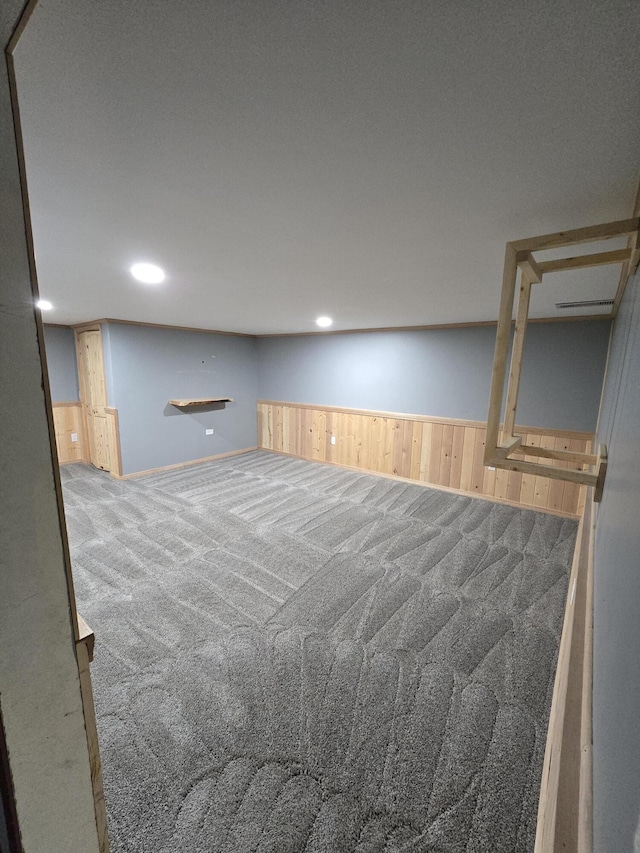 641 S Alder St, Colville, WA 99114 - unfurnished room featuring carpet floors, wooden walls, wainscoting, and recessed lighting