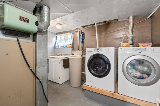680 S Cedar St, Colville, WA 99114 - laundry area featuring washer and clothes dryer and concrete block wall