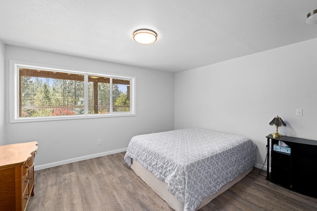 2534 United Copper Mine Rd Unit A, Chewelah, WA 99109 - bedroom featuring wood finished floors and baseboards