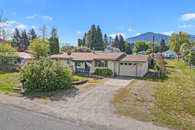 ranch-style home featuring driveway and a garage